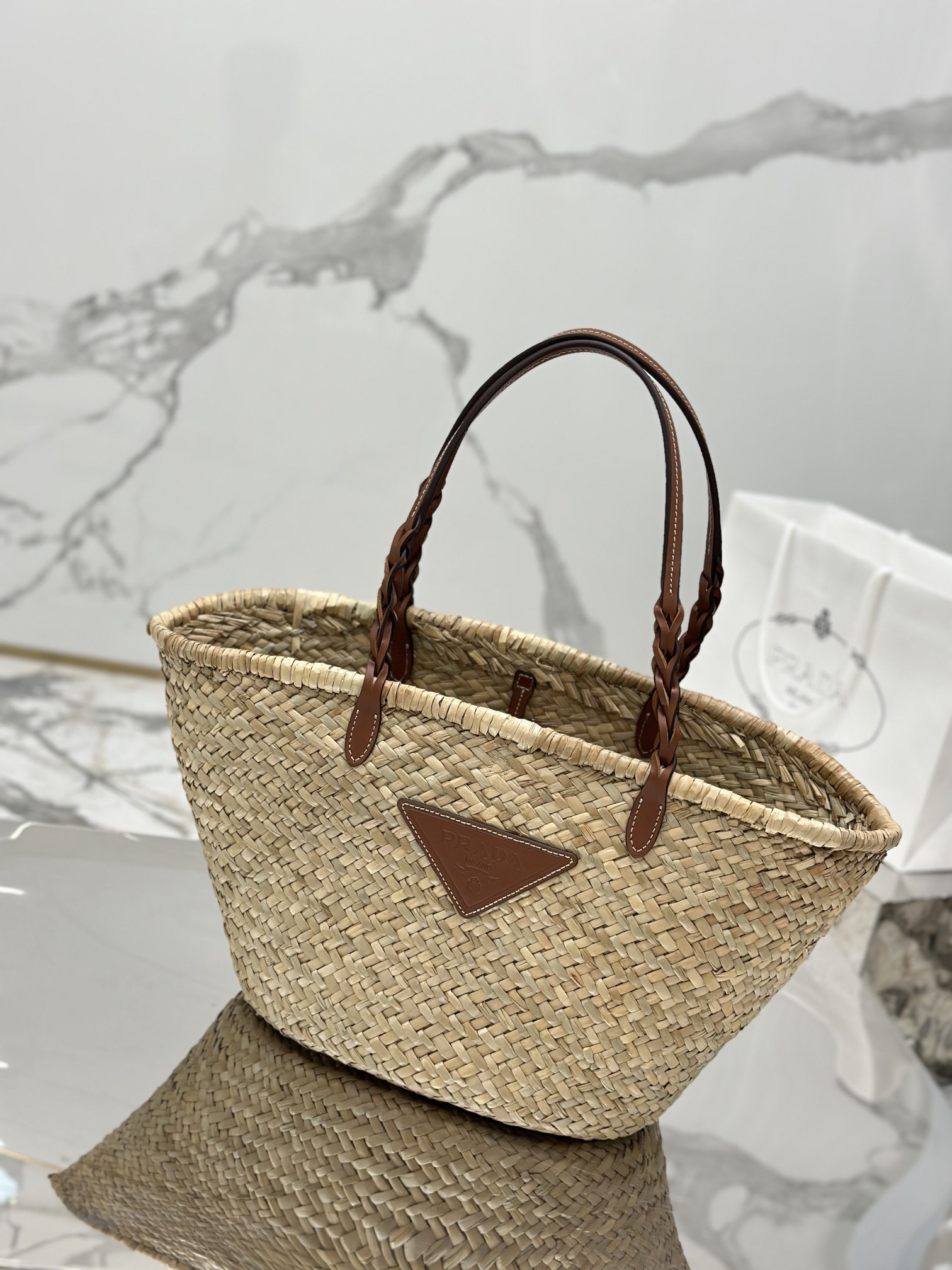 Pra*a woven palm and leather tote