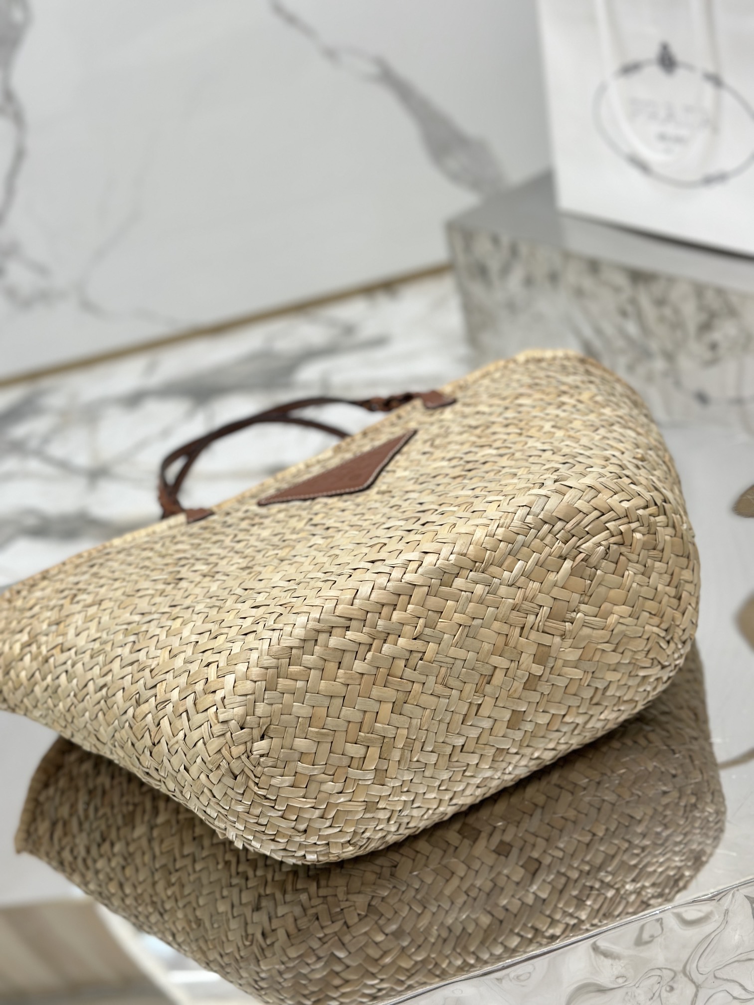 Pra*a woven palm and leather tote